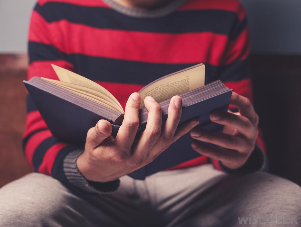 person-in-striped-shirt-reading-a-book